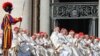 FILE - Cardinals attend mass in St. Peter's Square at the Vatican, May 15, 2022. Pope Francis named 21 new cardinals Sunday.