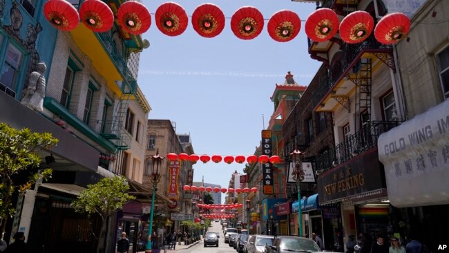 Lanterns hang in Chinatown above Grant Avenue in San Francisco, Monday, May 23, 2022. (AP Photo/Eric Risberg)