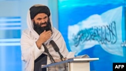 FILE - Taliban Interior Minister Sirajuddin Haqqani speaks during a ceremony marking the 30th anniversary of the victory over the government of communist regime, in Kabul on April 28, 2022. 