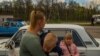 Irina fooled the Russian guards at a checkpoint in Vasylivka by telling them her younger son, Ihor, was very sick and needed to go to a hospital in Zaporizhzhia, April 27, 2022. (Yan Boechat/VOA) 