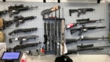 FILE - In this Feb. 19, 2021, photo, firearms are displayed at a gun shop in Salem, Ore.