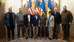 Ukrainian President Volodymyr Zelenskyy (center-right) poses for a photo with U.S. Senate Minority Leader Mitch McConnell (center-left), who led a delegation of Republican senators to Ukraine, in Kyiv, May 14, 2022. The senators are flanked by Ukrainian officials. (Office of the President of Ukraine)