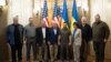 Ukrainian President Volodymyr Zelenskyy (center-right) poses for a photo with U.S. Senate Minority Leader Mitch McConnell (center-left), who led a delegation of Republican senators to Ukraine, in Kyiv, May 14, 2022. The senators are flanked by Ukrainian o