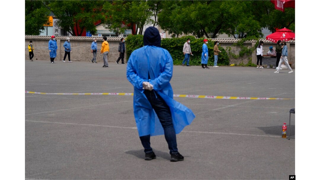 Residents line up for mass COVID-19 test in Beijing, May 9, 2022.