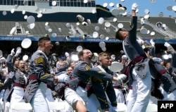 Class of 2022 cadets celebrate their graduation during commencement ceremonies at the US Military Academy West Point, May 21, 2022, in New York. (Photo by TIMOTHY A. CLARY / AFP)
