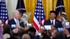 FILE - President Joe Biden, left, listens as Talib M. Shareef, President and Imam of Masjid Muhammad in Washington, speaks during a reception to celebrate Eid al-Fitr, in the East Room of the White House in Washington, May 2, 2022.