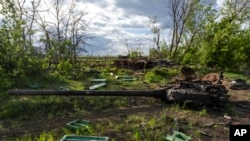 FILE - A destroyed tank near the village of Malaya Rohan, Kharkiv region, Ukraine, May 16, 2022. Twitter is stepping up its fight against misinformation with a new policy cracking down on posts that spread potentially dangerous false stories. 