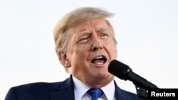 FILE-Former U.S. President Donald Trump speaks during a rally in Delaware, Ohio, to boost Ohio Republican candidates ahead of their May 3 primary election, April 23, 2022. 