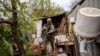 A Ukrainian National Guard soldier patrols during a reconnaissance mission in a recently retaken village on the outskirts of Kharkiv, east Ukraine, May 14, 2022.