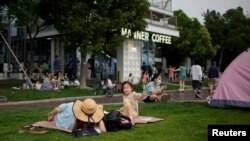 Men, women, and children flocked to outdoor venues such as parks after the lockdown to curb the coronavirus disease (COVID-19) outbreak was lifted, in Shanghai, China, June 1, 2022.