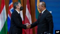 U.S. Secretary of State Antony Blinken and Turkish Foreign Minister Mevlut Cavusoglu meet at the Informal Meeting of NATO Ministers of Foreign Affair in Berlin, Germany, Sunday May 15, 2022.