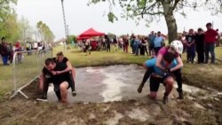 Hungarian Couples Compete in Wife-Carrying Race 