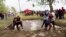Hungarian Couples Compete in Wife-Carrying Race 