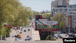 The coat of arms of Transnistria is depicted on a banner in central Tiraspol, self-styled capital of the pro-Russia separatist region in eastern Moldova, May 5, 2022.