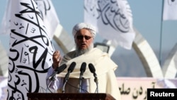 FILE: Afghan Deputy Prime Minister Mawlavi Abdul Salam Hanafi speaks during a ceremony to raise the Taliban flag in Kabul, Afghanistan, March 31, 2022. 