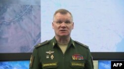 This video grab taken from a handout footage released by the Russian Defence Ministry on April 23, 2022, shows Russian Defense Ministry spokesman Major General Igor Konashenkov holding a briefing. 