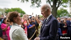 U.S. President Joe Biden greets Beatriz Gutierrez Mueller, the wife of Mexican President Andres Manuel Lopez Obrador, while hosting a Cinco de Mayo reception at the White House in Washington, U.S. May 5, 2022.