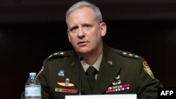 Defense Intelligence Agency, Lieutenant General Scott Berrier, testifies about worldwide threats during a Senate Armed Services Committee hearing on Capitol Hill in Washington, May 10, 2022.