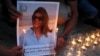 FILE - Family and friends of Al Jazeera reporter Shireen Abu Akleh attend a candlelight vigil outside the Church of the Nativity in Bethlehem, West Bank, May 16, 2022.