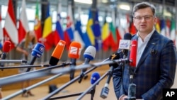 Ukraine's Foreign Minister Dmytro Kuleba arrives prior to talk to the press after a meeting of EU foreign ministers at the European Council building in Brussels, May 16, 2022.