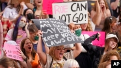 People attend an abortion-rights rally at the Utah State Capitol, May 5, 2022, in Salt Lake City.