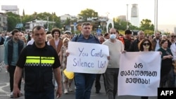 Demonstrators hold a rally in protection of independent media in Tbilisi, May 18, 2022, after Nika Gvaramia, an anchor and owner of the pro-opposition Mtavari TV, was sentenced to three-and-a-half years behind bars. 