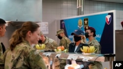 First lady Jill Biden serves meals to U.S. troops during a visit to the Mihail Kogalniceanu Air Base in Romania, May 6, 2022.