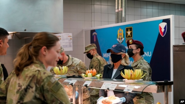 First lady Jill Biden serves meals to U.S. troops during a visit to the Mihail Kogalniceanu Air Base in Romania, May 6, 2022.