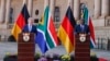 German Chancellor Olaf Scholz, left, and South African President Cyril Ramaphosa conduct a joint press conference during Scholz's visit at the Union Buildings in Pretoria on May 24, 2022.