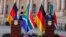 German Chancellor Olaf Scholz, left, and South African President Cyril Ramaphosa conduct a joint press conference during Scholz's visit at the Union Buildings in Pretoria on May 24, 2022.