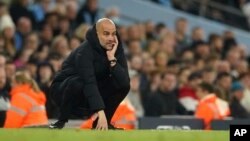 Mai horar da 'yan wasan Manchester City, Pep Guardiola (AP)