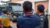 Relatives mourn as a vehicle carrying the bodies of victims of a plane crash arrive at a hospital in Kathmandu, Nepal, May 31, 2022.