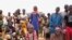 Internally displaced people wait for aid in Djibo, Burkina Faso, May 26, 2022. 