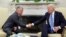 FILE - U.S. President Joe Biden shakes hands with Jordan's King Abdullah in the Oval Office at the White House in Washington, July 19, 2021. The king with meet with Biden in Washington on May 13, 2022.