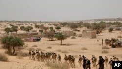 FILE: In this Saturday March 7, 2015 photo, African troops participate in exercises with the U.S. military's "US Africa Command" and its Western partners.
