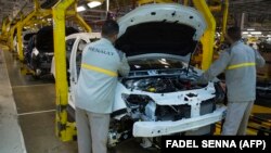 FILE: Factory employees work on a car assembly line at the Renault-Nissan Tanger Car Assembly Plant in Melloussa, east of the port city of Tangiers. Taken March 12, 2018