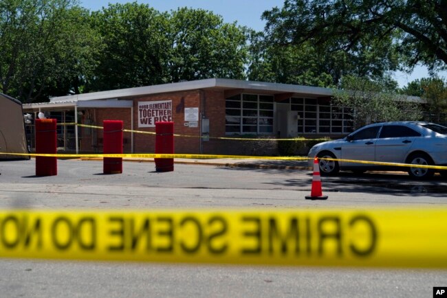 Crime scene tape surrounds Robb Elementary School in Uvalde, Texas, May 25, 2022. (AP Photo/Jae C. Hong)