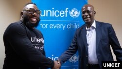 UNICEF Regional Director for East and Southern Africa, Mohamed Fall, greets UNICEF Goodwill Ambassador Tendai Mtawarira