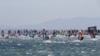 Competitors take the start of the first stage of the 20th edition of the Defi Wind windsurfing competition in the Mediterranean Sea, off the coat of Gruissan in southern France, May 26, 2022. 