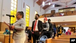 FILE - People line up to speak during a reparations task force meeting at Third Baptist Church in San Francisco on April 13, 2022.