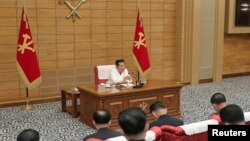 North Korean leader Kim Jong Un speaks at a politburo meeting of the Workers' Party on the country's coronavirus disease outbreak response in Pyongyang, May 28, 2022. (Korean Central News Agency/Reuters)