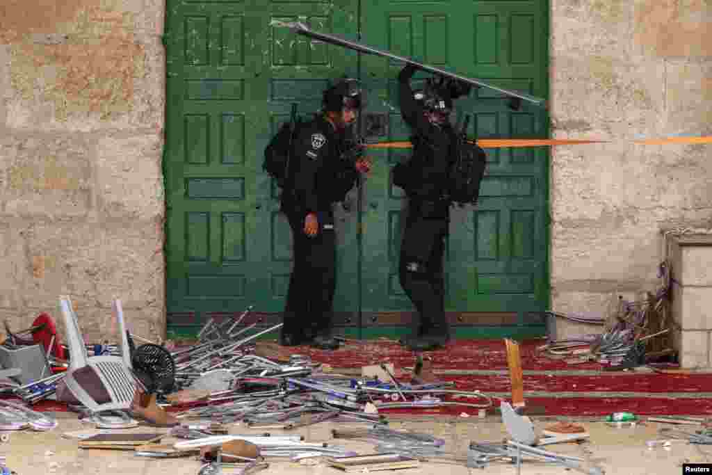 Israeli security forces secure a door at the compound that houses Al-Aqsa Mosque, known to Muslims as Noble Sanctuary and to Jews as Temple Mount, in Jerusalem&#39;s Old City.