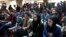 FILE - Afghan journalists attend a press conference of a former President Hamid Karzai in Kabul, Afghanistan, Feb. 13, 2022.