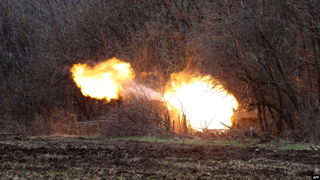 FILE - Ukrainian artillery shells Russian troops' position on the front line near Lysychansk in the Luhansk region, April 12, 2022.