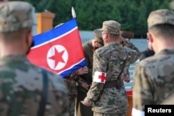 Military personnel from the Korean People's Army medical corps attend the launch of a campaign to improve the supply of medicines, amid the COVID-19 pandemic, in Pyongyang, North Korea. Undated photo by Korean Central News Agency via Reuters.