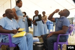 Malawian journalist, Kenneth Jali taking cholera vaccine , during the launch of the campaign in Blantyre, May 23, 2022. (Lameck Masina/VOA)