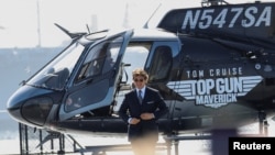 FILE - Tom Cruise arrives at the opening for the film Top Gun: Maverick on the USS Midway Museum in San Diego, California, U.S., May 4, 2022. (REUTERS/Mario Anzuoni)