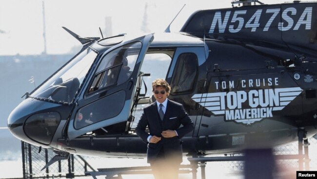 FILE - Tom Cruise arrives at the opening for the film Top Gun: Maverick on the USS Midway Museum in San Diego, California, U.S., May 4, 2022. (REUTERS/Mario Anzuoni)