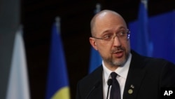 FILE - Ukraine Prime Minister Denys Shmyhal attends a press conference after a donor conference for his country in Warsaw, Poland, May 5, 2022. In recent meetings, Ukraine has secured promises of another $5 billion in aid.