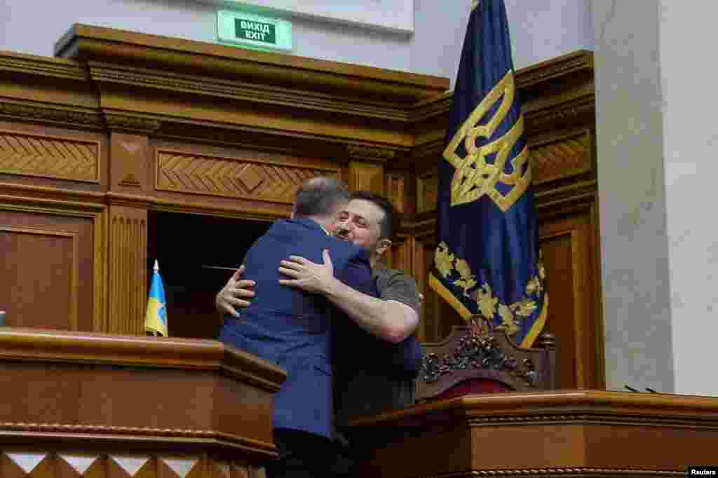 Polish President Andrzej Duda embraces Ukraine&#39;s President Volodymyr Zelenskiy during a session of Ukrainian parliament in Kyiv as Russia&#39;s attack on Ukraine continues.